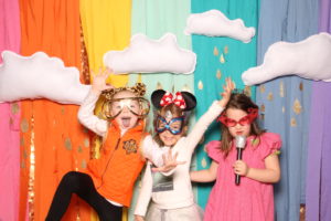 children in an open air photo booth in dallas texas